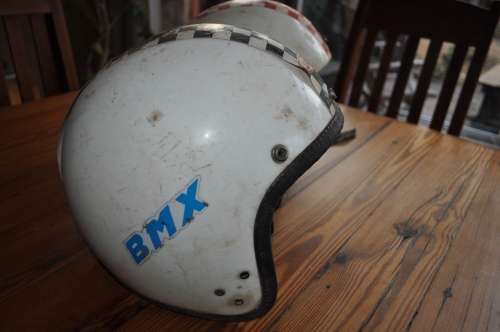 Vintage bicycle safety helmets with BMX stickers