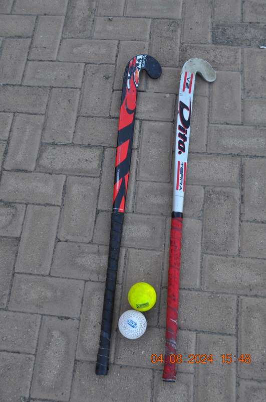 Hockey Sticks x 2 Plus 2 Balls