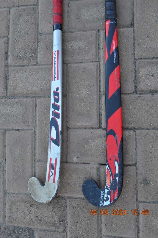 Hockey Sticks x 2 Plus 2 Balls