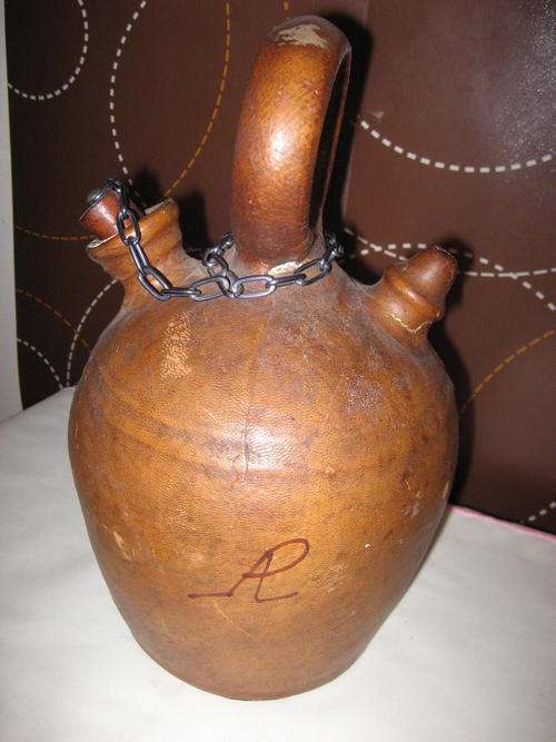 VINTAGE BOTTLE COVERED WITH LEATHER
