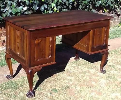 Very pretty, Stinkwood, Ball and Claw desk with five drawers and lovely linnenfold fronts.