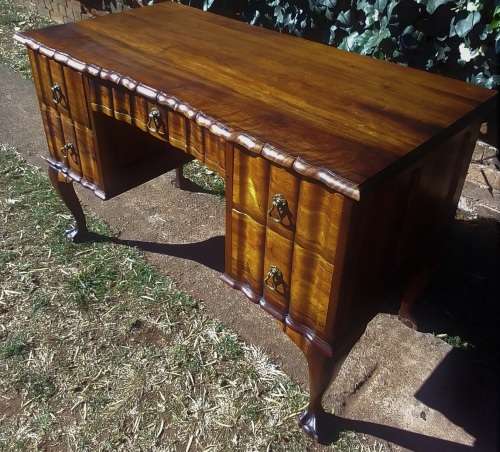 Very pretty, Stinkwood, Ball and Claw desk with five drawers and lovely linnenfold fronts.