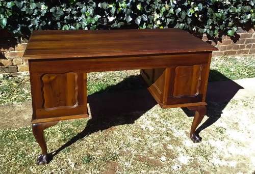 Very pretty, Stinkwood, Ball and Claw desk with five drawers and lovely linnenfold fronts.