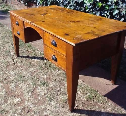Lovely 1800`s, rustic Oregon desk / table with four drawers, cup handles and thick tapered legs.