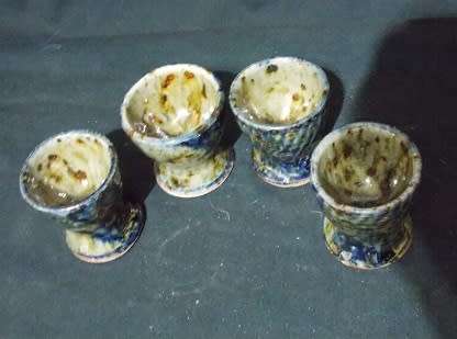 Set of Four Glazed Pottery Egg Cups