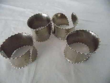 Set of Four Silver Colored Napkin Rings