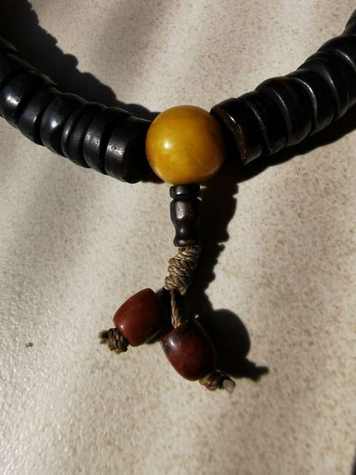 Chinese Qing Dynasty Buddhist mala beads made with 108 rosewood beads including 4 jade beads.