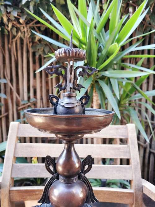A pair of copper candlesticks crafted in the late 19th century