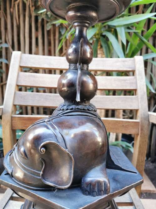 A pair of copper candlesticks crafted in the late 19th century