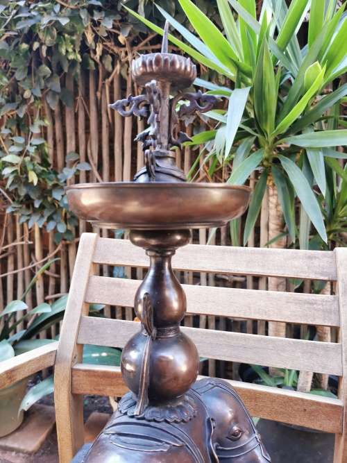 A pair of copper candlesticks crafted in the late 19th century