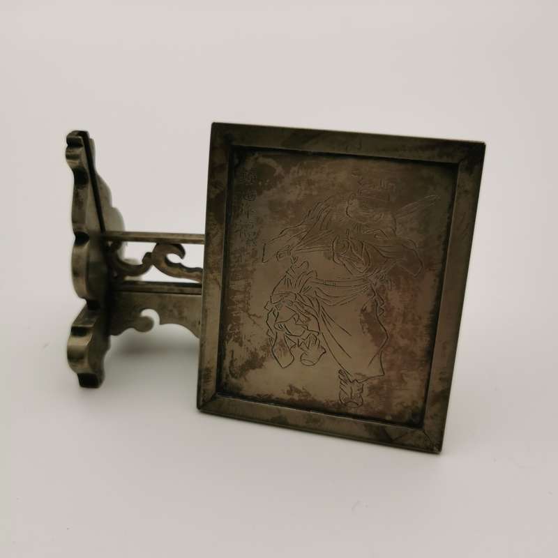 Decorated white copper ornament featuring the god Zhong Kui from the late Chinese Qing Dynasty