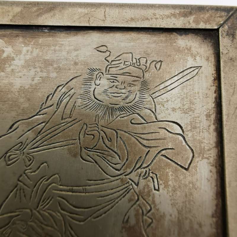 Decorated white copper ornament featuring the god Zhong Kui from the late Chinese Qing Dynasty