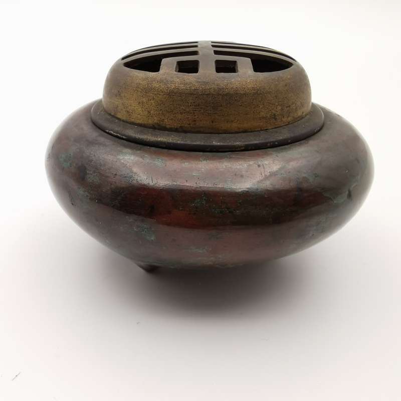 A copper incense burner with a longevity character pattern in the late Qing Dynasty of China