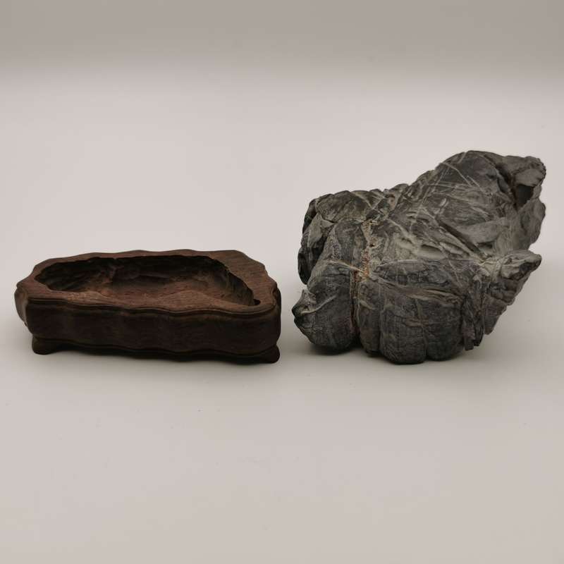 Antique Natural stone ornaments with a rosewood base