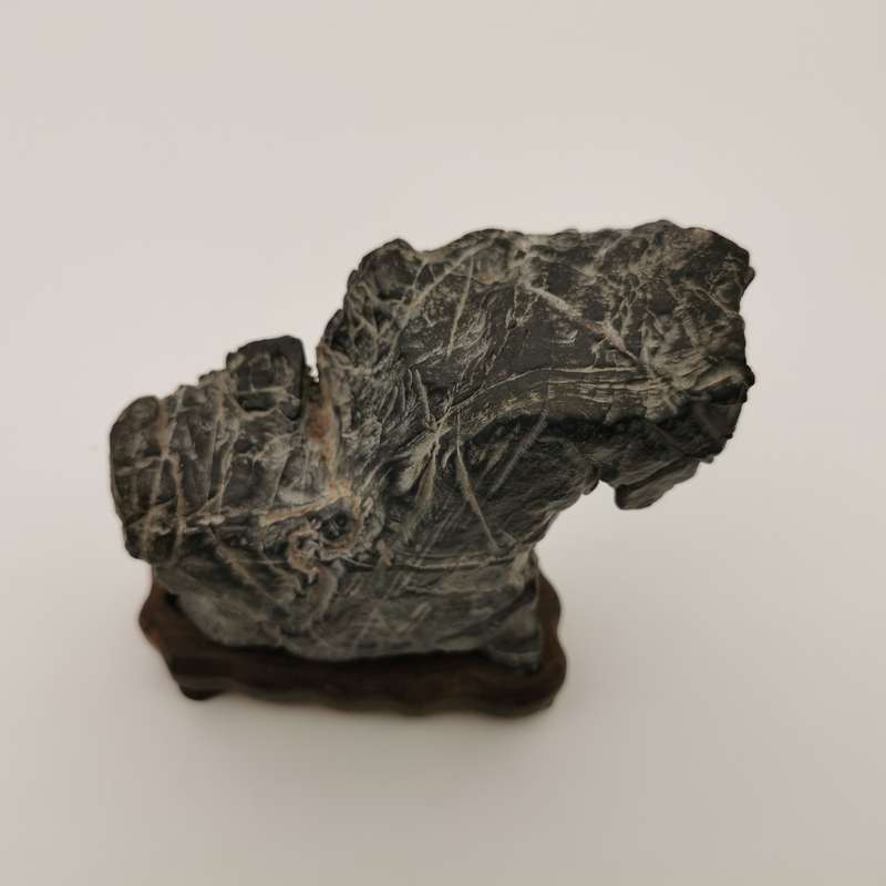 Antique Natural stone ornaments with a rosewood base