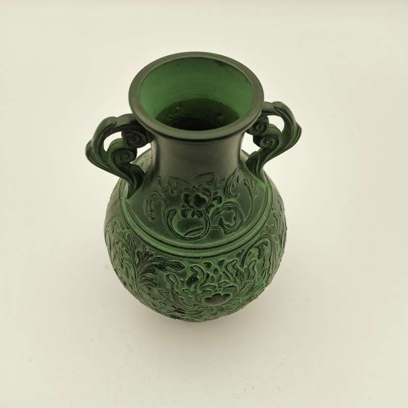SOLID BRONZE ANTIQUE CHINESE VASE WITH RAISED RELIEF DECORATION.