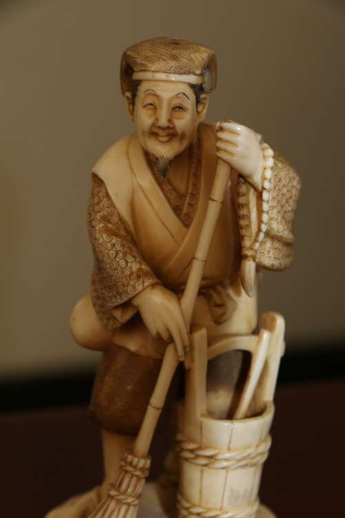 A Japanese ivory carved figure