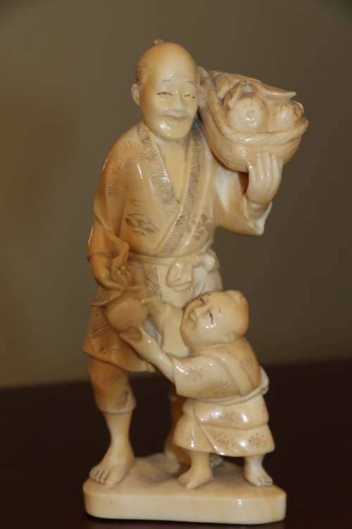 A Japanese ivory carved figure
