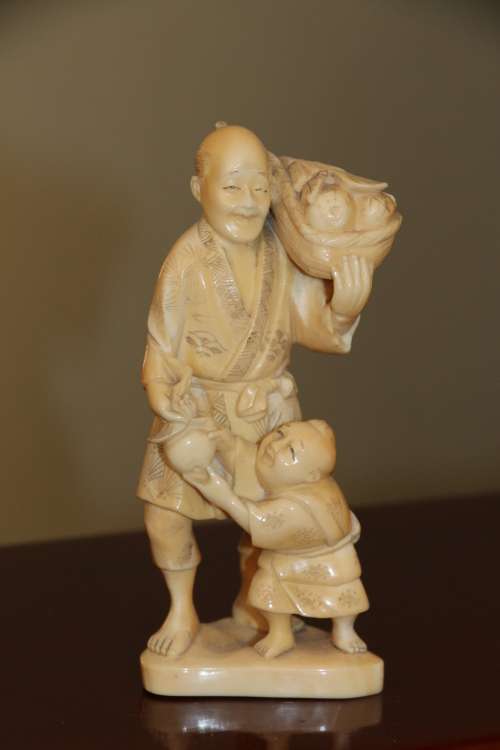 A Japanese ivory carved figure