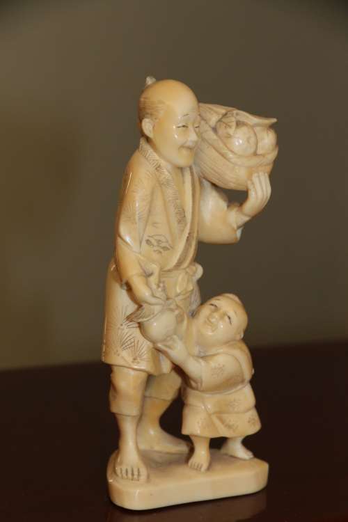 A Japanese ivory carved figure