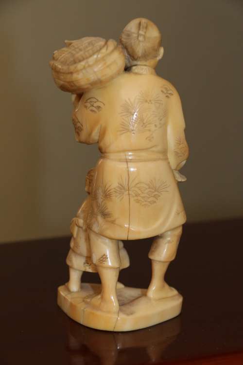 A Japanese ivory carved figure