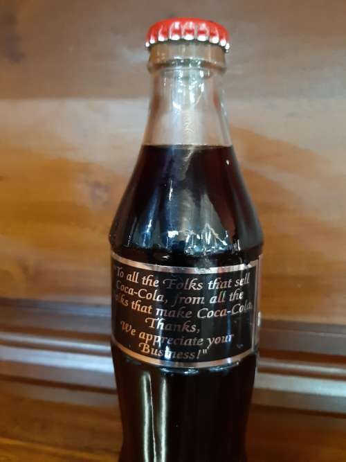 Coca-Cola sealed bottle `to all the folks that sell Coca-Cola ....`