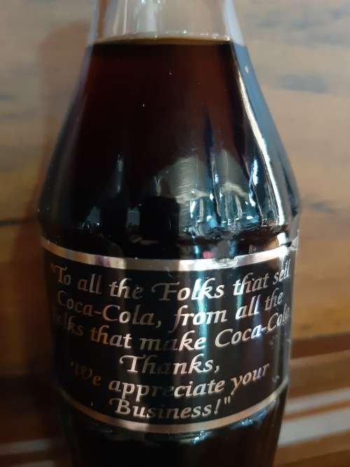 Coca-Cola sealed bottle `to all the folks that sell Coca-Cola ....`