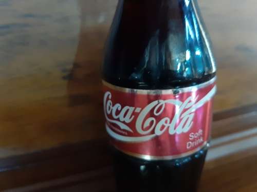 Coca-Cola sealed bottle `to all the folks that sell Coca-Cola ....`