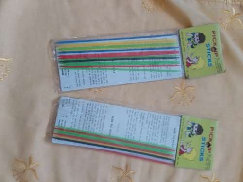 Paper Dolls with uncut and cut out clothes plus 2 new pick up sticks games - very good condition