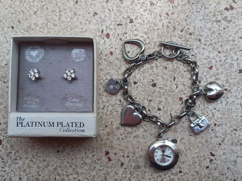 Collectors Cubic Zirconia earings from the Platinum plated collection and a charm bracelet