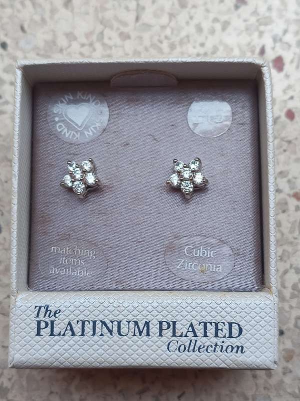 Collectors Cubic Zirconia earings from the Platinum plated collection and a charm bracelet