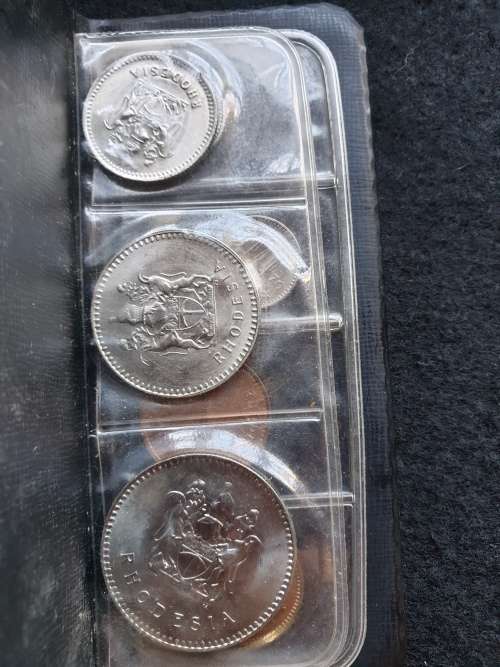 SET OF COINS OF RHODESIA  ** SIX UNCIRCULATED COINS IN PLASTIC FOLDER**