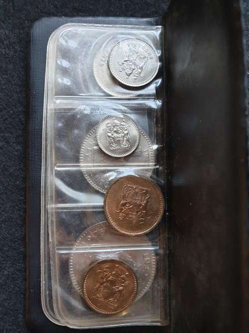 SET OF COINS OF RHODESIA  ** SIX UNCIRCULATED COINS IN PLASTIC FOLDER**