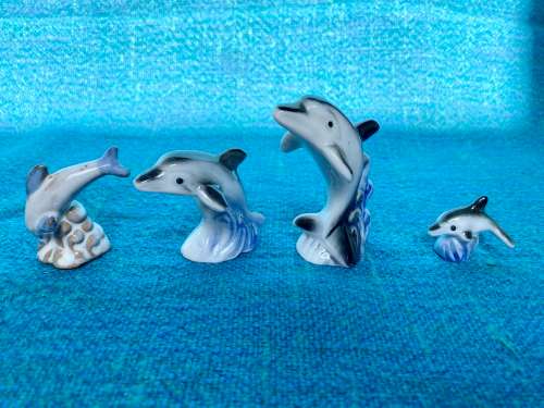 Porcelain dolphins (4) vintage, approx.from the  80s, collection item,