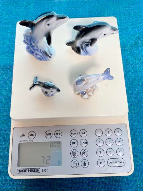 Porcelain dolphins (4) vintage, approx.from the  80s, collection item,