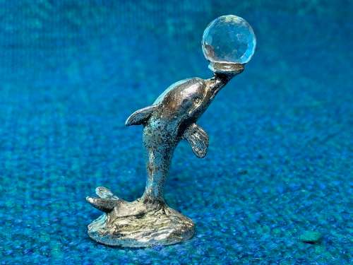 Dolphin figure with glass ball , vintage , collecorts item