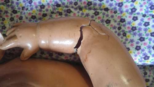 Vintage Bakelite Doll (damaged)