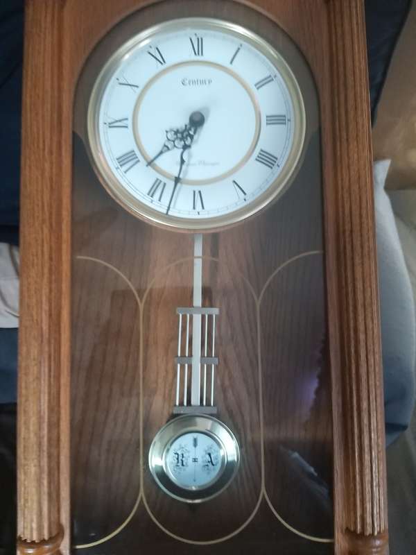 # Reduced# Timeless Walnut Finish Wall Clock