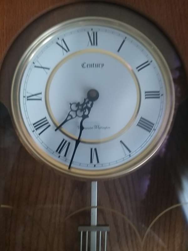 # Reduced# Timeless Walnut Finish Wall Clock