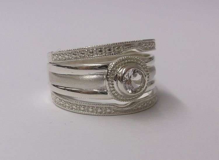 A BEAUTIFUL SOLID STERLING SILVER THREE PIECE WEDDING RING SET WITH FACETED CLEAR STONE...WOW !!!