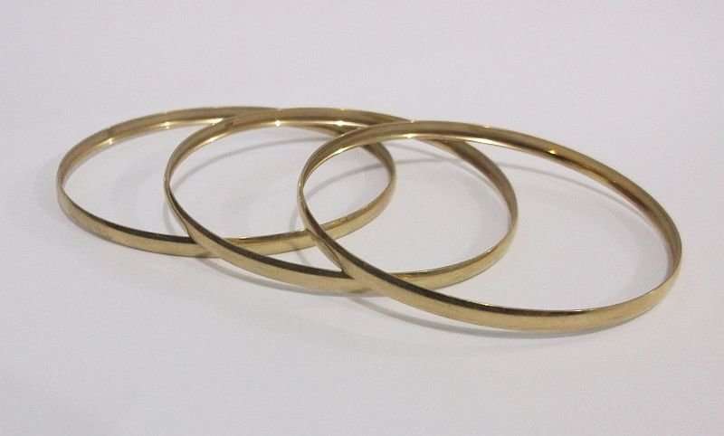 FANTASTIC DEAL .....THREE GORGEOUS SOLID 9 CARAT GOLD BANGLES ....BID FOR THE LOT