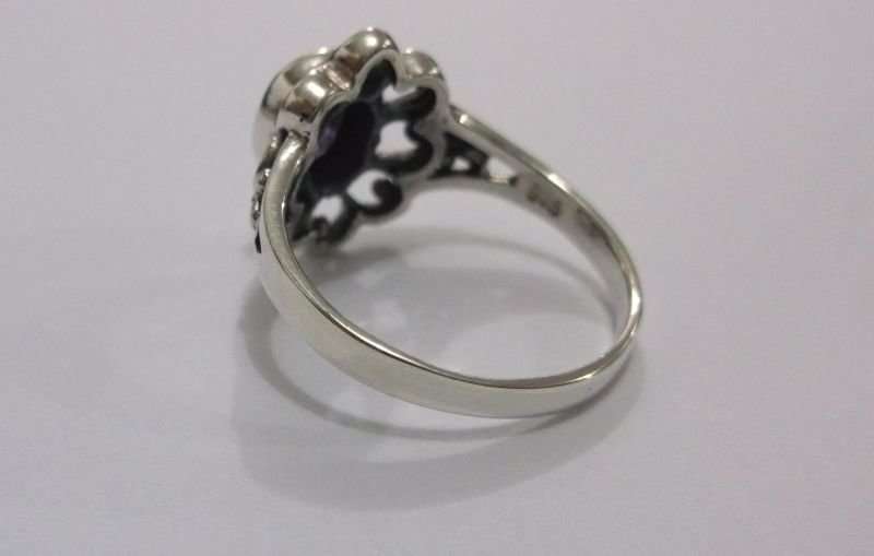 A GORGEOUS SOLID STERLING SILVER RING SET WITH A FACETED PURPLE STONE ...AWESOME !!!