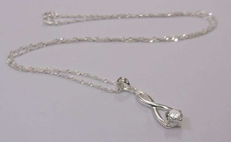 CLASSY STERLING SILVER PENDANT WITH FACETED CLEAR STONE PLUS A 45 CM STERLING SILVER NECKLACE