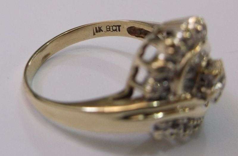 A BEAUTIFUL 9 CARAT GOLD ANGEL RING SET WITH A MIND BLOWING 19 FACETED DIAMONDS VALUED AT R 11 000