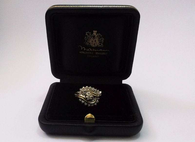 A BEAUTIFUL 9 CARAT GOLD ANGEL RING SET WITH A MIND BLOWING 19 FACETED DIAMONDS VALUED AT R 11 000