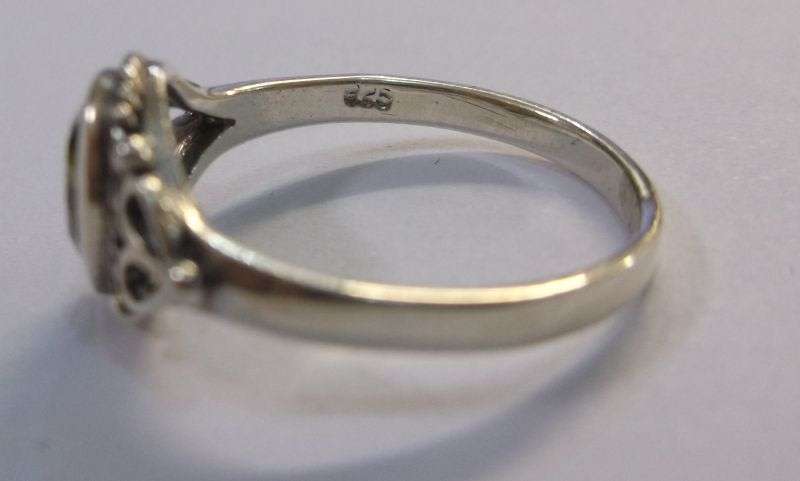 WOW !!! A VERY STYLISH SOLID STERLING SILVER RING SET WITH A FACETED GREEN STONE ....LAST ONE !!!