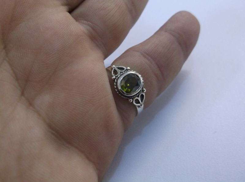 WOW !!! A VERY STYLISH SOLID STERLING SILVER RING SET WITH A FACETED GREEN STONE ....LAST ONE !!!