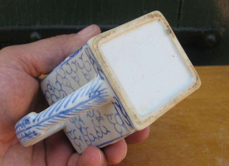 AN EYE CATCHING VINTAGE HAND PAINTED MINIATURE TEAPOT WITH CHINESE THEME AND FIGURAL SPOUT...WOW !!