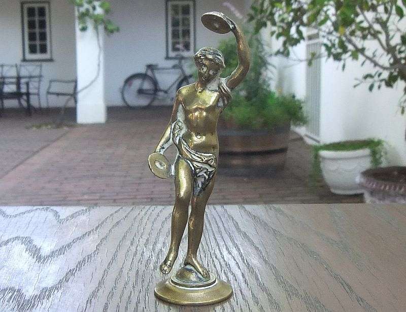 AN AWESOME OLD SOLID BRASS STATUE OF A ROMANESQUE FIGURE ...PERHAPS DANCING ...DETAILED PIECE !!