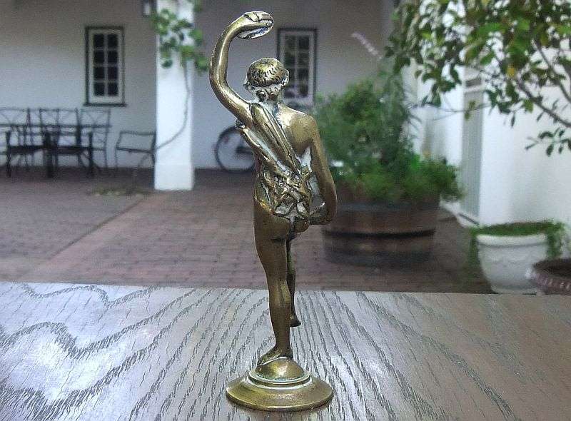 AN AWESOME OLD SOLID BRASS STATUE OF A ROMANESQUE FIGURE ...PERHAPS DANCING ...DETAILED PIECE !!
